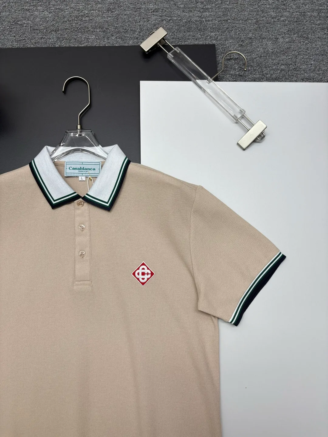 CASABLANCA New Arrival embroidered Polo shirt, original fabric, official Same Style, made of pure cotton pique fabric, customized vat-dyed fabric, feels very comfortable and smooth, very wide and stylish, produced by the first-line brand Factory, imported Behringer embroidery machine, embroidery is full and textured, collar and collar ribs are woven with imported yarn, does not deform after long-term wear, the latest New Arrival style in spring and summer, fashionable and individual Super Versatile, a good-looking one. It is very suitable for both men and women. It is a must-have for everyone. Color: Black White, Apricot, Blue Khaki Size: M-3XL